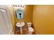 Cozy powder room featuring a pedestal sink, toilet, and a decorative light fixture at 10245 Missouri Meadows St, Las Vegas, NV 89183
