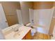 Bathroom featuring a vanity with a sink, toilet, and shower-tub combination at 10245 Missouri Meadows St, Las Vegas, NV 89183