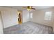 Large bedroom with neutral decor, plush carpeting, and natural light from two windows at 10245 Missouri Meadows St, Las Vegas, NV 89183