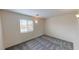 Bedroom with a window providing natural light and a carpeted floor at 10245 Missouri Meadows St, Las Vegas, NV 89183