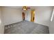 This is a large bedroom that includes neutral colors, soft carpeting, and a ceiling fan with light fixture at 10245 Missouri Meadows St, Las Vegas, NV 89183