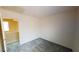 Neutral-toned bedroom with gray carpeting and access to the upper level at 10245 Missouri Meadows St, Las Vegas, NV 89183