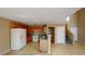 Inviting kitchen featuring wooden cabinets and a breakfast bar open to living area at 10245 Missouri Meadows St, Las Vegas, NV 89183