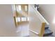 Carpeted staircase leading to a bright living space with high ceilings and large windows at 10245 Missouri Meadows St, Las Vegas, NV 89183
