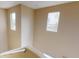 Upstairs hallway with a view of the neighborhood through a small window at 10245 Missouri Meadows St, Las Vegas, NV 89183