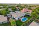 Spacious backyard with sparkling pool, lush lawn, and outdoor seating area, perfect for entertaining at 10969 Tranquil Waters Ct, Las Vegas, NV 89135
