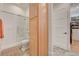Bathroom featuring glass enclosed shower and vanity with light wood cabinets at 10969 Tranquil Waters Ct, Las Vegas, NV 89135