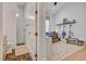 Connected bedroom suite with an accessible shower, neutral tile, and hardwood floors at 10969 Tranquil Waters Ct, Las Vegas, NV 89135