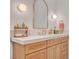 The bathroom features a light wood vanity and a round mirror at 10969 Tranquil Waters Ct, Las Vegas, NV 89135