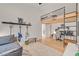 Unique bedroom with a loft area, ladder, hardwood floors, guitars, and comfortable lounging spots at 10969 Tranquil Waters Ct, Las Vegas, NV 89135