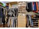 Well-organized walk-in closet with custom shelving and ample storage space for clothing and accessories at 10969 Tranquil Waters Ct, Las Vegas, NV 89135