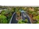 Community entrance featuring palm trees and well-maintained landscaping at 10969 Tranquil Waters Ct, Las Vegas, NV 89135
