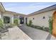 Stylish home entrance with modern door and beautiful landscaping at 10969 Tranquil Waters Ct, Las Vegas, NV 89135