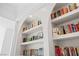 Close up of the custom, built-in bookshelves at 10969 Tranquil Waters Ct, Las Vegas, NV 89135