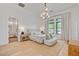 Serene main bedroom with a plush bed, elegant lighting, and large windows, offering a peaceful retreat at 10969 Tranquil Waters Ct, Las Vegas, NV 89135