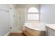 Bright bathroom features a walk-in shower and separate soaking tub at 10993 Ladyburn Ct, Las Vegas, NV 89141
