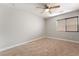 Bedroom with neutral carpeting, ceiling fan, window and outlets at 10993 Ladyburn Ct, Las Vegas, NV 89141