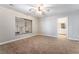 Comfortable carpeted bedroom featuring a large window with blinds at 10993 Ladyburn Ct, Las Vegas, NV 89141