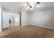 Spacious bedroom with plush carpeting and a ceiling fan at 10993 Ladyburn Ct, Las Vegas, NV 89141