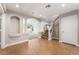Bright foyer showcasing arched entryways, decorative columns, stairs, and tile flooring at 10993 Ladyburn Ct, Las Vegas, NV 89141