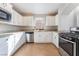 Bright kitchen featuring granite countertops, stainless steel appliances, and white cabinets at 10993 Ladyburn Ct, Las Vegas, NV 89141
