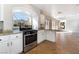 View of kitchen's stainless steel oven leading to an open-concept living area at 10993 Ladyburn Ct, Las Vegas, NV 89141