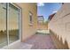 A side yard area with gravel and artificial grass, perfect for relaxation and play at 11247 Villa Trentino Ct, Las Vegas, NV 89141