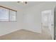 Bedroom features neutral carpet and natural light plus a view to the hallway at 11247 Villa Trentino Ct, Las Vegas, NV 89141