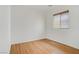 Empty bedroom featuring wood floors and a window at 11247 Villa Trentino Ct, Las Vegas, NV 89141