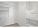 Walk-in closet with built-in shelving and drawers at 11247 Villa Trentino Ct, Las Vegas, NV 89141