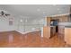 Bright kitchen with a breakfast bar, stainless steel sink, and wood cabinets at 11247 Villa Trentino Ct, Las Vegas, NV 89141