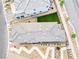 An aerial view of the home, highlighting the roof, backyard with artificial grass, and landscaping at 11800 Black Canary Ave, Las Vegas, NV 89138