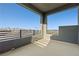 Open air balcony with sleek design, offering views of the neighborhood and distant mountains at 11800 Black Canary Ave, Las Vegas, NV 89138