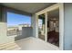 Open balcony view showcasing a modern sliding door entry and scenic views of the neighborhood at 11800 Black Canary Ave, Las Vegas, NV 89138