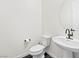 This powder room features pedestal sink, dark fixtures, and a modern design at 11800 Black Canary Ave, Las Vegas, NV 89138