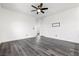 This spacious bedroom features wood-look floors, baseboards, and neutral paint at 11800 Black Canary Ave, Las Vegas, NV 89138