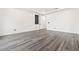 This bedroom has wood-look floors, baseboards, and neutral paint at 11800 Black Canary Ave, Las Vegas, NV 89138