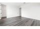 Bright bedroom features modern wood flooring, and a walk in closet at 11800 Black Canary Ave, Las Vegas, NV 89138