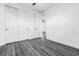 A bright bedroom features clean white walls, wood floors, and a double door closet at 11800 Black Canary Ave, Las Vegas, NV 89138