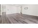Spacious bedroom has wood-look floors, baseboards, and neutral paint at 11800 Black Canary Ave, Las Vegas, NV 89138