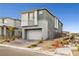 Modern two-story home with a two-car garage, neutral paint scheme, and xeriscaping in a residential neighborhood at 11800 Black Canary Ave, Las Vegas, NV 89138