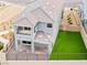 Aerial view of the gray home showing the backyard, patio, and second story balcony at 11800 Black Canary Ave, Las Vegas, NV 89138