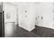 Foyer with dark tile flooring, white walls, and a staircase leading to the upper level of the home at 11800 Black Canary Ave, Las Vegas, NV 89138