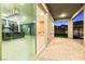 A look from the outdoor patio through the sliding doors into the modern open living area at 11800 Black Canary Ave, Las Vegas, NV 89138