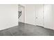 Neutral room with gray tile flooring leading to staircase at 11800 Black Canary Ave, Las Vegas, NV 89138