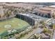 Aerial view showcasing the golf entertainment complex, resort building, and parking areas at 125 E Harmon Ave # 2814/2816, Las Vegas, NV 89109