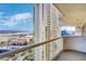 Spectacular view of the city from a high-rise balcony, showcasing the building's modern architecture at 125 E Harmon Ave # 2814/2816, Las Vegas, NV 89109