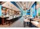 An elegant bar with counter seating and tables provides a great spot for socializing with beautiful blue accents at 125 E Harmon Ave # 2814/2816, Las Vegas, NV 89109