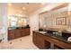 Bathroom featuring dual sink vanities, tile floors, and modern fixtures at 125 E Harmon Ave # 2814/2816, Las Vegas, NV 89109