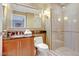 Bathroom showcasing a vanity with granite countertop and glass-enclosed shower at 125 E Harmon Ave # 2814/2816, Las Vegas, NV 89109